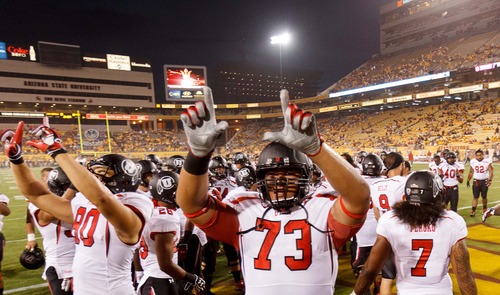 Trent Nelson  |  The Salt Lake Tribune
Utah offensive linesman Jeremiah Poutasi (73) and teammates call out to Utah fans as the University of Utah prepares to face Arizona State, college football in Tempe, Arizona, Saturday, September 22, 2012.