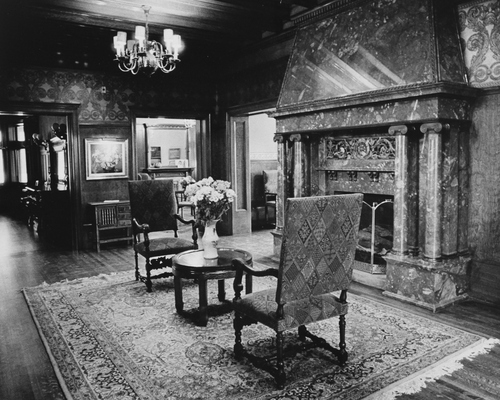 Salt Lake Tribune archive

Interior of the home of Alfred William McCune in Salt Lake City. The home, located on north Main Street, cost $500,000 to build in 1901. McCune was a very successful business man with ventures in railroad and mining. He was a partner in the Peruvian Cerro de Pasco mines along with J. P. Morgan, William Randolph Hearst, and Frederick William Vanderbilt. McCune wanted his home to be extravagant. The McCune home site was chosen to rise up impressively over the nearby streets, and little expense was spared on decoration. McCune had materials shipped from San Domingo, England and South Africa. The red roof tiles came from Holland, and an enormous broad mirror wall was transported from Germany in a specially made railroad car. The walls were adorned with moiré silks, tapestries, and Russian leather. The exterior of the home was built of red Utah sandstone although some details like the lavish fireplaces used more exotic stone like Nubian marble.