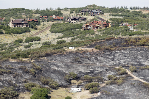 Al Hartmann  |  The Salt Lake Tribune
Burned areas came almost to the proerty line of owners of the Promontory gated community.  on August 16, 2013.