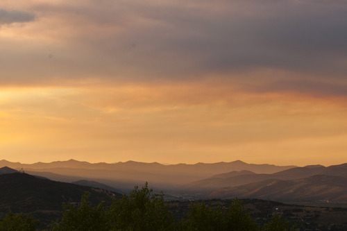 Chris Detrick  |  The Salt Lake Tribune
With smoke from wildfires in the air, the sun sets over Park City Friday August 16, 2013.