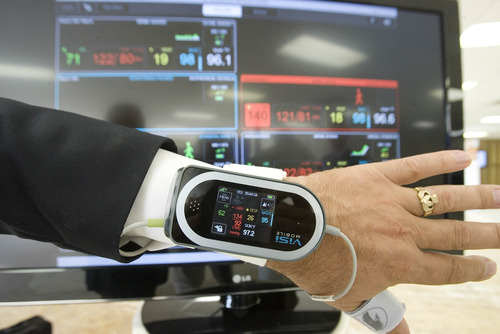 Paul Fraughton  |   The Salt Lake Tribune
The  ViSi Mobile patient monitor on display in the Health CareTransformation Lab. It shows all vital signs and skin temperature of a patient fitted with sensors and a wrist monitor.  The information for several patients is also displayed at a nurses' station. The body worn sensors allow freedom of movement for the patient as well as non-invasive blood pressure monitoring                  
 Tuesday, August 20, 2013