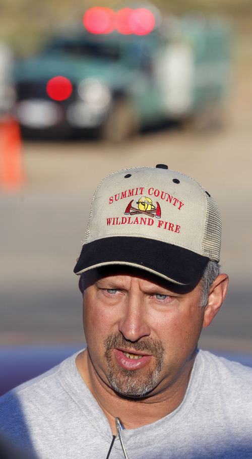 Al Hartmann  |  The Salt Lake Tribune
Rockport fire incident commader Bryce Boyer with the Utah Division of State Lands speaks residents of Rockport Estates upon going back to their homes Monday morning after being evacuated nearly a week ago.