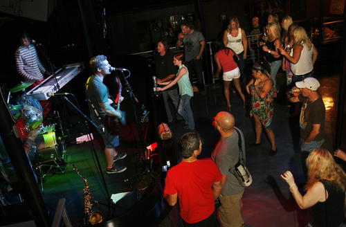 Scott Sommerdorf   |  The Salt Lake Tribune
Aaron Borowitz, and "Thrive" plays at The Royal - a new bar that is run by the local band Royal Bliss, Friday, August 16, 2013.