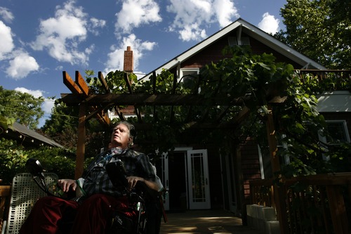 Leah Hogsten  |  The Salt Lake Tribune
Brooke Hopkins enjoys the sights and sounds of nature from his backyard deck in Salt Lake City's Avenues on Aug. 18, 2010, nearly two years after his bike collision.