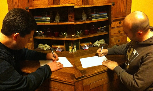 David Powers King, left, and Michael Jensen sign a deal with Cedar Fort Publishing's Sweetwater Books for their novel "Woven" in January. (Courtesy photo)