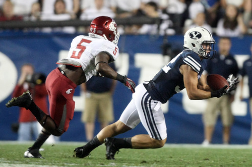 Chris Detrick  |  The Salt Lake Tribune
Brigham Young Cougars defensive back Mike Hague (32) almost intercepts a pass intended for Washington State Cougars running back Rickey Galvin (5) during the first half of the game against Washington State at LaVell Edwards Stadium Thursday August 30, 2012. BYU is winning the game 24-6.