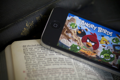 Jeremy Harmon  |  The Salt Lake Tribune

Anecdotally, more and more people are playing with their mobile devices during religious services. But are they using the devices to follow along with the sermon, or are they just using the time to shoot birds at pigs?