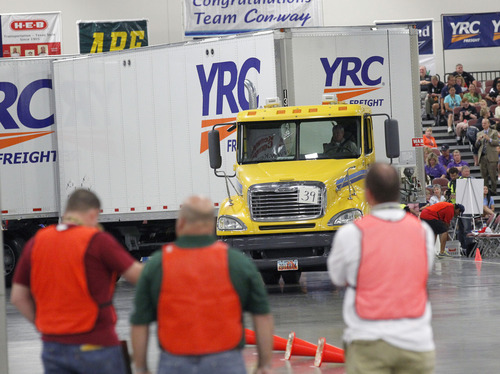 Al Hartmann  |  The Salt Lake Tribune
Judges scrutinize drivers' abilities to the inch as they weave their big rigs through a difficult course to test their skills inside the Salt Palace Convention Center for the American Trucking Association National Truck Driving Championships in which 424 of the best professional truck drivers from around the country competed in nine different truck classes.