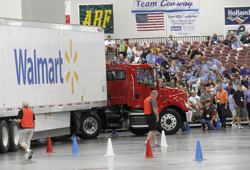 Al Hartmann  |  The Salt Lake Tribune
Judges scrutinize drivers' abilities to the inch as they drive their big rigs through a difficult course to test their skills inside the Salt Palace Convention Center for the American Trucking Association National Truck Driving Championships in which 424 of the best professional truck drivers from around the country competed in nine different truck classes.