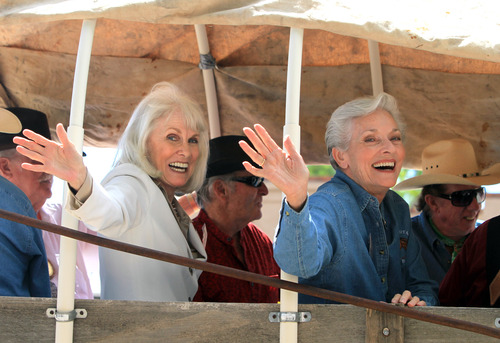 Rick Egan   |  The Salt Lake Tribune

Actress Bridget Hanley (Here come the Brides) and Lee Meriwether (catwoman) wave from a covered wagon during the parade during the Western Legends Round Up,  Saturday, August 28, 2010.