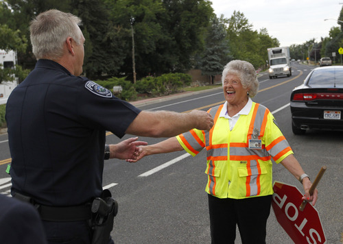 Al Hartmann  |  The Salt Lake Tribune
Salt Lake County Sheriff James Winder surprises crossing guard Leora Farnsworth, 79,  with a hug of thanks at her school crossing on Spring Lane in Holladay Friday. Gov. Gary Herbert was next in line for a hug.  Herbert declared Friday as Crossing Guard Appreciation Day, recognizing crossing guards' efforts to keep the Utah children safe.