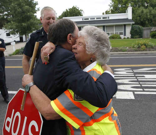Al Hartmann  |  The Salt Lake Tribune
Gov. Gary Herbert gives crossing guard Leora Farnsworth, 79,   a big hug of thanks to congratulate her on her 39 years of service at her school crossing lane on Spring Lane in Holladay on Friday. Herbert declared Friday as Crossing Guard Appreciation Day, recognizing crossing guards' efforts to keep the Utah children safe.