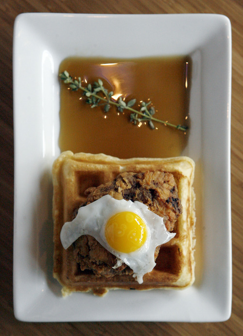 Francisco Kjolseth  |  The Salt Lake Tribune
Dish of the week comes from the Avenues Proper & Publick House. Chicken and Waffles - house made chicken sausage, waffle, thyme infused maple syrup and quail egg. $10.