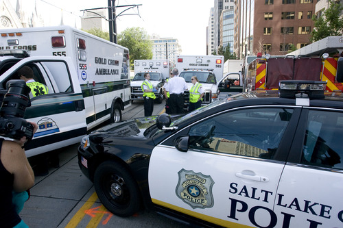 Rick Egan  |  The Salt Lake Tribune 
Emergency vehicles line up on South Temple after toxic fumes were accidentally released in the South Visitors Center at Temple Square, Thursday, August 22, 2013.