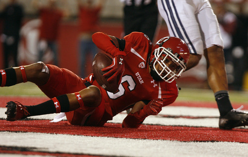 Scott Sommerdorf  |  The Salt Lake Tribune             
Utah Utes wide receiver Dres Anderson (6) rolls over in the end zone after his TD catch to make the score 24-7 after the PAT. Utah led BYU 24-7 at the end of the third quarter, Saturday, September 15, 2012.