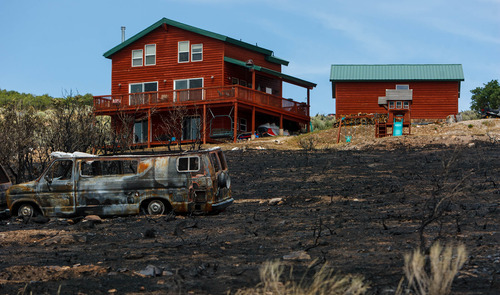 Trent Nelson  |  The Salt Lake Tribune
A home spared from the fire in the Lake Rockport Estates, Thursday August 22, 2013. A Utah program requires new construction to reduce brush and trees around houses. This fuels mitigation strategy creates a defensible space so that wildfires have a decreased chance of burning structures.