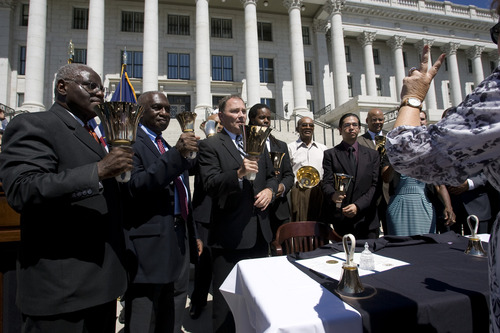 Rick Egan  | The Salt Lake Tribune 

Forrest Crawford (left), the Rev. France Davis of Calvary Baptist Church and Gov. Gary Herbert ring bells as part of a "Let Freedom Ring" celebration of the 50th anniversary of Dr. Martin Luther King Jr.'s "I Have a Dream" speech at the Utah Capitol, Wednesday, Aug. 28, 2013.