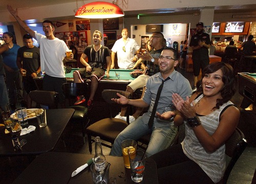 Leah Hogsten | The Salt Lake Tribune
Guillermo Melara and his girlfriend Carina Hernandez (right) and their friends express their confusion at the unanimous win by Phil Davis over Lyoto Machita at Lumpy's Downtown bar  for Saturday's Ultimate Fighting Championship pay-per-view TV event, August 3, 2013. UFC, the most elite mixed martial arts promoter by far, once planned an event for Salt Lake City and canceled  because of poor early ticket sales. UFC has a particularly strong Utah following, and pay-per-view numbers are said to be off the charts and Utahns are clamoring for a UFC event at EnergySolutions.