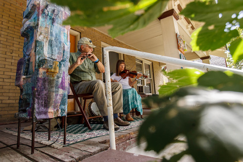 Trent Nelson  |  The Salt Lake Tribune
Ross Faison and Mary Finch (The Antrim Rose) perform as part of Porchfest, a neighborhood festival Saturday, August 24, 2013, in Salt Lake City. At left is artwork by Andrea Henkels Heidinger