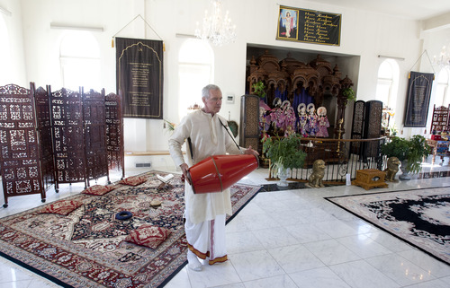 Steve Griffin | The Salt Lake Tribune
Music plays an important role in Krishna worship. Here, the temple priest, Caru Das, plays an instrument inside the Sri Sri Radha Krishna Temple in Spanish Fork on Thursday, Aug. 15, 2013.