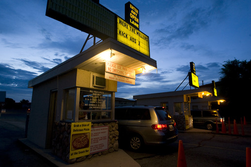 Rick Egan  | The Salt Lake Tribune 

The entrance of the Redwood Drive-In in West Valley City Monday, August 19, 2013. Drive-ins nationwide are crossing over to digital, and that means buying more expensive equipment. Weekend swap meets help cover the cost, owners say.