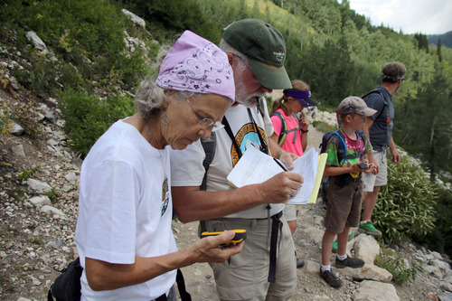 Francisco Kjolseth  |  The Salt Lake Tribune
Members of the Utah Environmental Congress, Whitney Zack and Bob Brister record the location of a Pica as they conduct one of two Citizen Science counts on pikas near Twin Lakes Reservoir, near Brighton on Sunday, August 11, 2013. Pika's, a high-mountain dweller about 6 to 8 inches long are very sensitive to heat and can't live in temperaturess above 80 degrees making them an indicator species for climate change.