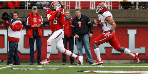 Trent Nelson  |  The Salt Lake Tribune
Dres Anderson pulls in a long pass ahead of Davion Orphey during the University of Utah's Red-White Spring football game, Saturday April 20, 2013 in Salt Lake City.