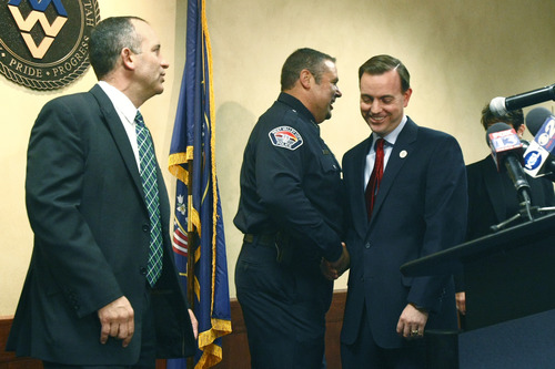 Chris Detrick  |  The Salt Lake Tribune
West Valley City Police Chief Lee Russo and Mayor Mike Winder shake hands during a press conference at West Valley City Hall Tuesday August 27, 2013. "I saw this as an opportunity that I was well-matched for," Lee Russo said at a news conference Tuesday, announcing his selection. At left is West Valley City Manager Wayne Pyle.