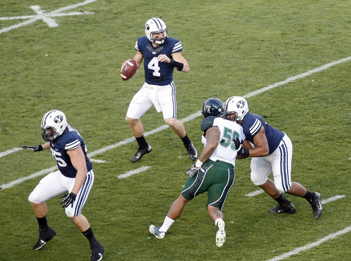 Chris Detrick  |  The Salt Lake Tribune
Brigham Young Cougars quarterback Taysom Hill (4) looks to pass the ball during the first half of the game at LaVell Edwards Stadium Friday September 28, 2012.