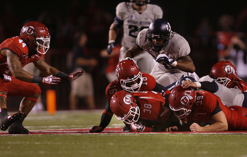 Scott Sommerdorf   |  The Salt Lake Tribune
Utah RB Karl Williams recovers an on-side kick to give Utah the ball after they had shaved USU's lead to 23-17. Utah went on to score on William's TD run to take a 24-23 lead. Utah beat Utah State 30-26, Thursday, August 29, 2013.