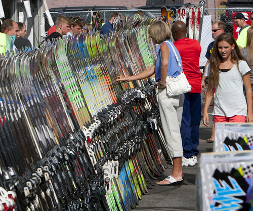 Steve Griffin | The Salt Lake Tribune

Shoppers check out the deals during the Ski N See's fall sale in the parking lot outside the Sandy store Thursday Aug. 22, 2013.