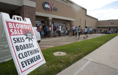 Steve Griffin | The Salt Lake Tribune

Shoppers line up outside the Ski N See store in Sandy on Thursday Aug. 22, 2013. The  fall ski blowout sale started at 5 p.m. in the parking lot outside the store.