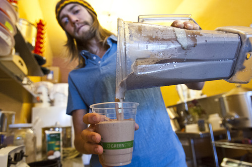 Chris Detrick  |  The Salt Lake Tribune
Chocolate alchemist AJ Wentworth makes a chocolate smoothie made with coconut sugar, coconut milk, vanilla beans, Dominican Republic cocoa and ice ($7.50) at The Chocolate Conspiracy in Salt Lake City Thursday August 8, 2013.