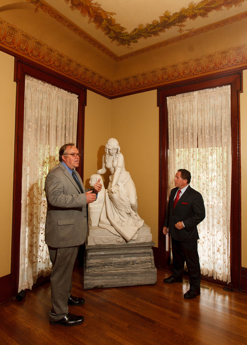 Trent Nelson  |  The Salt Lake Tribune
Mark Magleby, director of the Museum of Art at Brigham Young University, and Phil McCarthey speak at the McCune Mansion Tuesday, August 27, 2013 in front of Cleopatra, sculpted by Oscar Spalmach (1864–1917). The piece, in addition to another titled Blind Girl, has returned to the McCune Mansion after spending many years at the BYU Museum of Art.