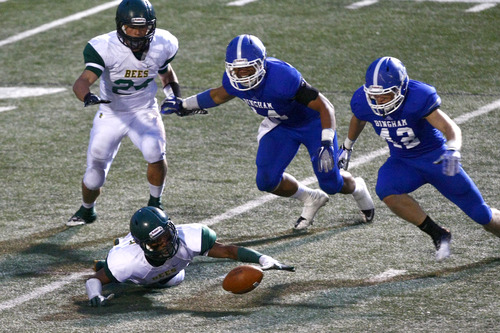 Chris Detrick  |  The Salt Lake Tribune
Bonneville's Lincoln Clayton (2) Bingham's Vaka Vehikite (14) and Nick Heninger (42) go after a loose ball during the game at Bingham High School Saturday August 24, 2013. Bingham is winning the game 14-7 at halftime.