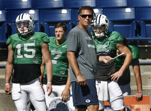 Scott Sommerdorf   |  The Salt Lake Tribune
BYU OC Robert Anae watches a play alonside three of his QBs, from left to right; QB Ammon Olsen #15, Christian Stewart #7, and Taysom Hill #4, during football practice at BYU, Wednesday, August 21, 2013.