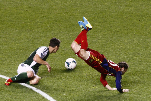 Chris Detrick  |  The Salt Lake Tribune
Portland Timbers midfielder Ben Zemanski (14) trips Real Salt Lake midfielder Ned Grabavoy (20) during the first half of the game at Rio Tinto Stadium Friday August 30, 2013. Zemanski was given a red card.