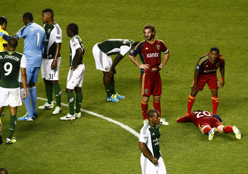 Chris Detrick  |  The Salt Lake Tribune
Real Salt Lake forward Jou Plata (8) checks on Real Salt Lake midfielder Ned Grabavoy (20) after he was tripped by Portland Timbers midfielder Ben Zemanski (14) during the first half of the game at Rio Tinto Stadium Friday August 30, 2013. Zemanski was given a red card.