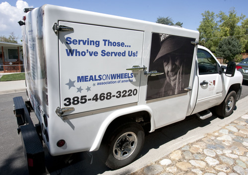 Steve Griffin  |  The Salt Lake Tribune
A Meals on Wheels truck pulls up outside the Cottonwood Heights home of Art and Doris Smith to deliver lunch Friday Aug. 29, 2013.