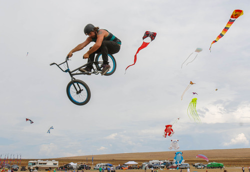 Trent Nelson  |  The Salt Lake Tribune
Jonesy Fedderson shares the sky with a variety of kites during the Antelope Island Stampede on Saturday at Antelope Island's White Rock Bay.