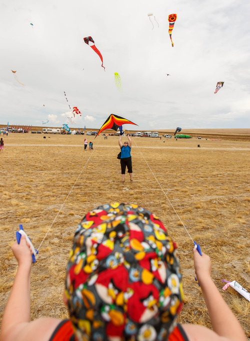 Trent Nelson  |  The Salt Lake Tribune
Connor Vincent gets some help from his grandmother Margaret Putnam, flying a kite at the Antelope Island Stampede, on Saturday at Antelope Island's White Rock Bay.