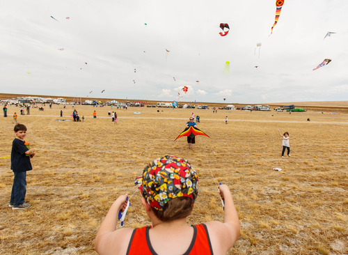 Trent Nelson  |  The Salt Lake Tribune
Connor Vincent gets some help from his grandmother Margaret Putnam, flying a kite at the Antelope Island Stampede, Saturday, August 31, 2013 at Antelope Island's White Rock Bay.