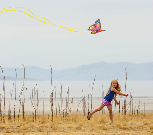 Trent Nelson  |  The Salt Lake Tribune
Alexus Oladi flies a kite during the Antelope Island Stampede, Saturday, August 31, 2013 at Antelope Island's White Rock Bay.