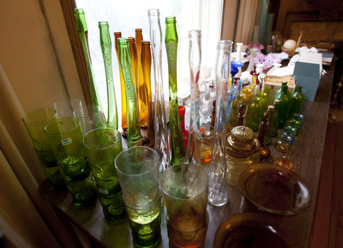 Steve Griffin  |  The Salt Lake Tribune
Glassware in the former home of Oscar and Beverly Rowland in Salt Lake City Wednesday Aug. 27, 2013. The Avenues home has sat vacant for three years because the Rowlands' children were intimidated about how to handle its contents. The family's first attempt at unloading Oscar's vast collection will be Sept. 6-8, and it will take up a full eight rooms of his Avenues house. What they sell will make room for them to explore other rooms full of yet-to-be explored boxes.