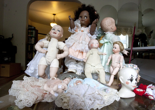 Steve Griffin  |  The Salt Lake Tribune
Dolls are displayed in the former home of Oscar and Beverly Rowland in Salt Lake City Wednesday Aug. 27, 2013. The Avenues home has sat vacant for three years because the Rowlands' children were intimidated about how to handle its contents. The family's first attempt at unloading Oscar's vast collection will be Sept. 6-8, and it will take up a full eight rooms of his Avenues house. What they sell will make room for them to explore other rooms full of yet-to-be explored boxes.