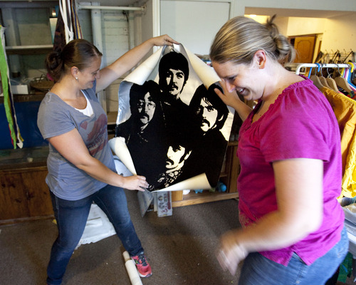 Steve Griffin  |  The Salt Lake Tribune
Lisa Rowland and Tiffany Morris laugh as they find a velvet poster of the Beatles in the former home of their late grandparents, Oscar and Beverly Rowland, in Salt Lake City Wednesday Aug. 27, 2013. The Avenues home has sat vacant for three years because the Rowlands' children were intimidated about how to handle its contents. The family's first attempt at unloading Oscar's vast collection will be Sept. 6-8, and it will take up a full eight rooms of his Avenues house. What they sell will make room for them to explore other rooms full of yet-to-be explored boxes.