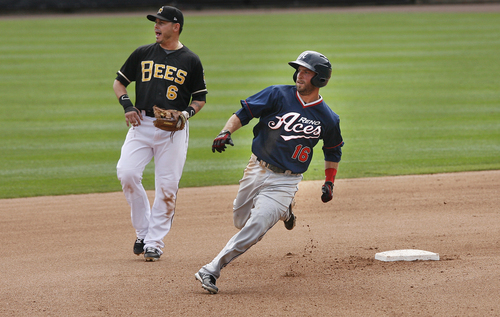 Scott Sommerdorf   |  The Salt Lake Tribune
Bees 2nd baseman Luis Rodriguez yells as the Aces' Tyler Bortnick rounds second on his way to third during a six-run second inning the Bees never recovered from. The Salt Lake Bees lost 10-7 to the Reno Aces, Sunday, September 1, 2013.