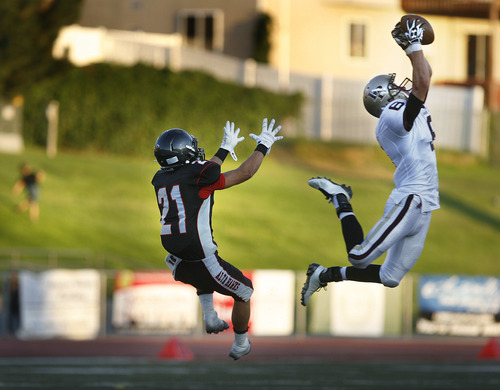 Scott Sommerdorf   |  The Salt Lake Tribune
Lone Peak DB Matt Criddle intercepts this pass intended for Alta's Mate Teahhan during first half play. Lone Peak held a 10-7 lead over Alta at the half, Friday, August 30, 2013.