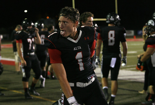 Scott Sommerdorf   |  The Salt Lake Tribune
Alta WR Mack Richards makes a face for the fans after a 64 yard TD catch and run to give Alta a 28-10 lead. Alta beat Lone Peak 35-17 in Sandy, Friday, August 30, 2013.