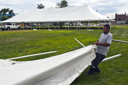 Chris Detrick  |  The Salt Lake Tribune
Diamond Rental's Erik Gallardo works at setting up tents at Magna Park Sunday September 1, 2013.